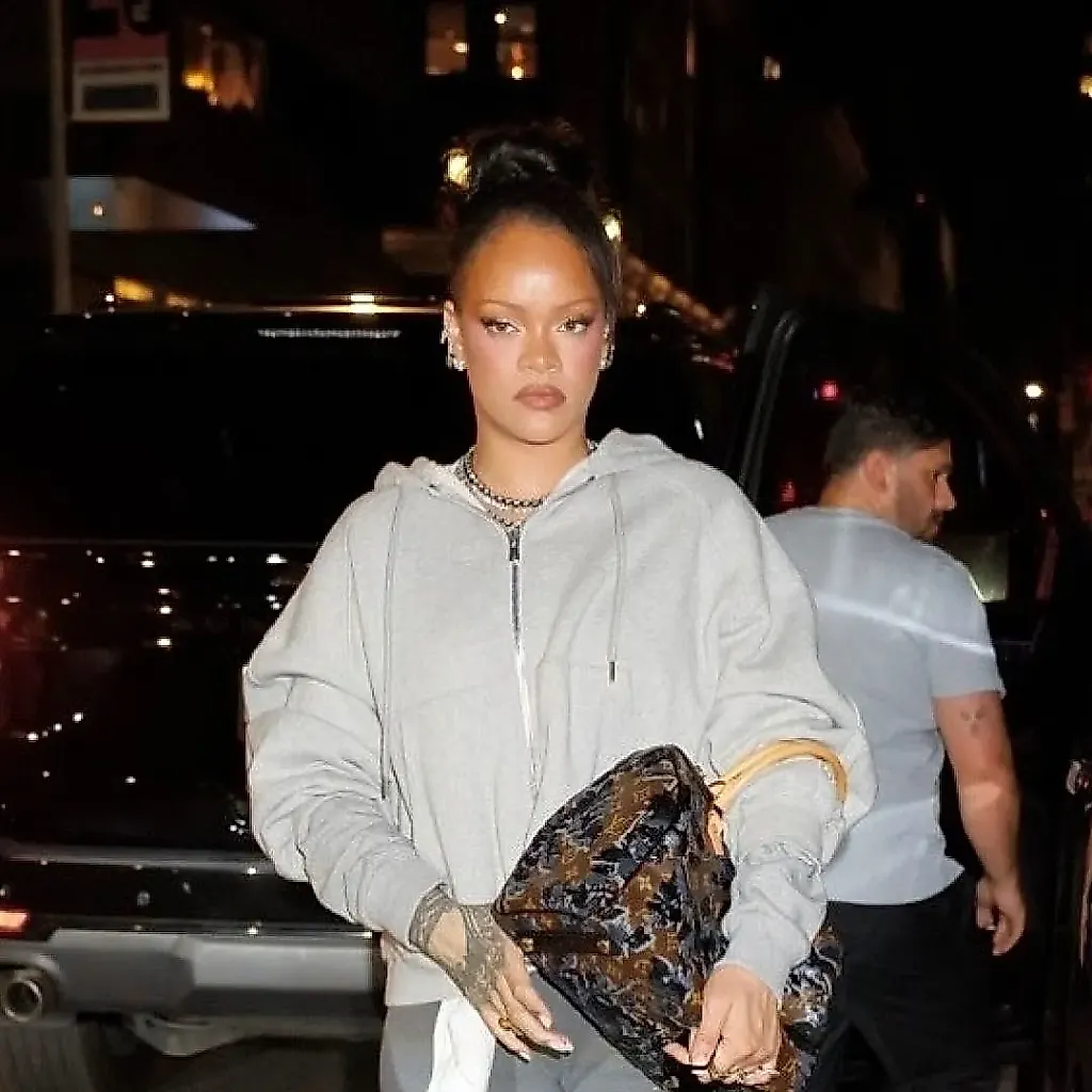 Rihanna Dresses Up Her Sweats With a Sold-Out Louis Vuitton Sequin Bag and Crystal-Covered Gucci Pumps